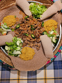 Meat platter with injera and salads